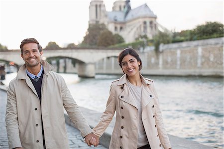 france couple - Couple holding hands along Seine River near Notre Dame Cathedral, Paris, France Stock Photo - Premium Royalty-Free, Code: 6113-07543662