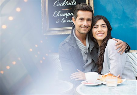 people drinking coffee at cafe - Couple hugging at sidewalk cafe in Paris, France Stock Photo - Premium Royalty-Free, Code: 6113-07543637