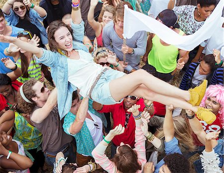 simsearch:6113-07564921,k - Woman crowd surfing at music festival Stock Photo - Premium Royalty-Free, Code: 6113-07564887