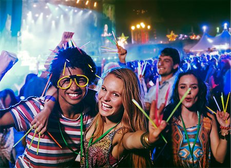 simsearch:649-08576877,k - Portrait of friends with glow sticks at music festival Stock Photo - Premium Royalty-Free, Code: 6113-07564823