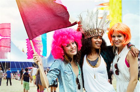 Portrait of friends in wigs at music festival Stock Photo - Premium Royalty-Free, Code: 6113-07564835
