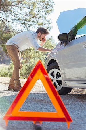 simsearch:6113-07565005,k - Man at roadside checking car engine behind warning triangle Stock Photo - Premium Royalty-Free, Code: 6113-07564982