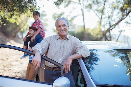 Portrait of senior man leaning on car Stock Photo - Premium Royalty-Free, Code: 6113-07565045