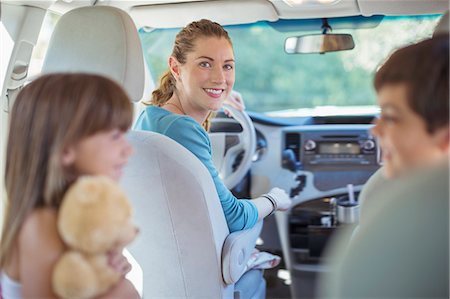 Portrait of smiling mother with family in car Stock Photo - Premium Royalty-Free, Code: 6113-07565094