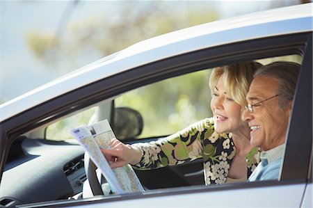 retired couple outside - Senior couple looking at map inside car Stock Photo - Premium Royalty-Free, Code: 6113-07565024