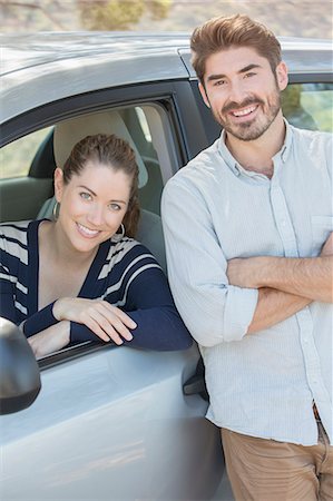 simsearch:6113-07565080,k - Portrait of smiling couple inside and outside car Stock Photo - Premium Royalty-Free, Code: 6113-07565144