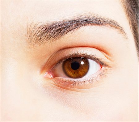 simsearch:6113-07565306,k - Extreme close up of brown eye Stock Photo - Premium Royalty-Free, Code: 6113-07565283