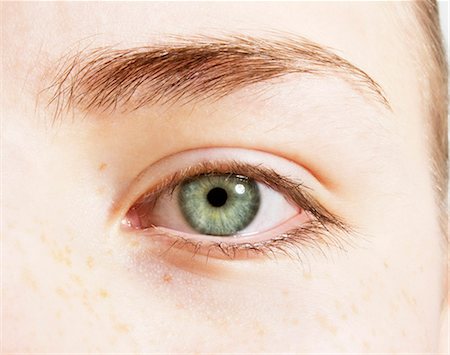 Premium Photo  Close up of a green eye and eye lashes