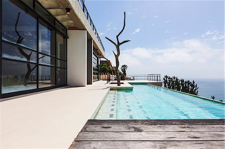 pool terrace - Luxury lap pool overlooking ocean Stock Photo - Premium Royalty-Free, Code: 6113-07565229