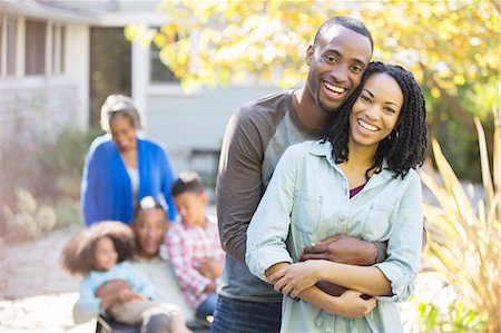 Portrait of happy couple hugging outdoors Foto de stock - Sin royalties Premium, Código: 6113-07565451