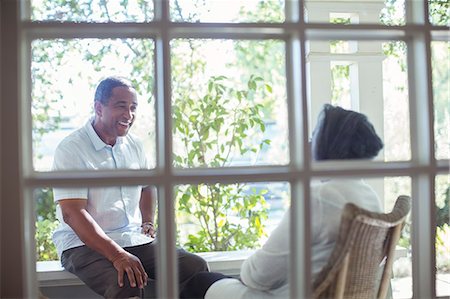 porch - Happy senior couple talking on porch Stock Photo - Premium Royalty-Free, Code: 6113-07565544