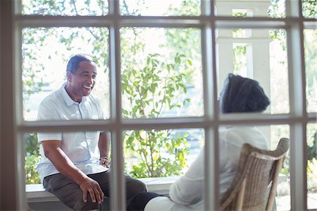 porch not pillows nobody - Happy senior couple talking on porch Stock Photo - Premium Royalty-Free, Code: 6113-07565544