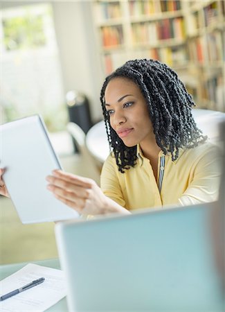 reading ebook - Woman using digital tablet Stock Photo - Premium Royalty-Free, Code: 6113-07565554