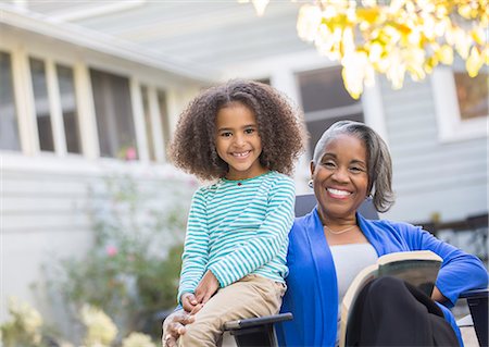 simsearch:6113-06626338,k - Portrait of happy grandmother and granddaughter on patio Stock Photo - Premium Royalty-Free, Code: 6113-07565611