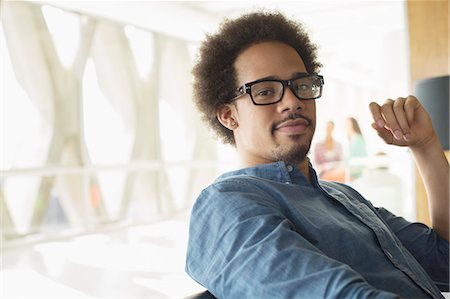 portrait casual indoors not mature not child - Portrait of confident casual businessman wearing eyeglasses Stock Photo - Premium Royalty-Free, Code: 6113-07565840