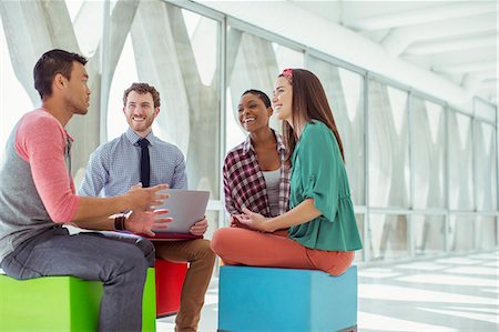 simsearch:6113-07565913,k - Creative business people meeting on colorful stools Foto de stock - Sin royalties Premium, Código: 6113-07565878