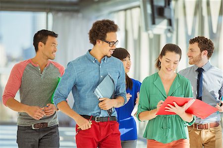 Creative business people walking in office corridor Foto de stock - Sin royalties Premium, Código: 6113-07565880