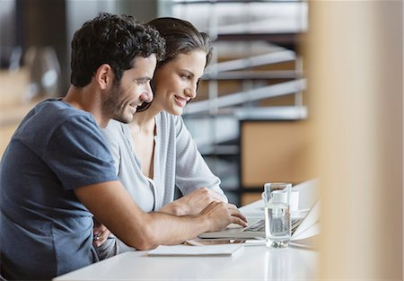 people and computers - Couple using laptop at table Stock Photo - Premium Royalty-Free, Code: 6113-07565809