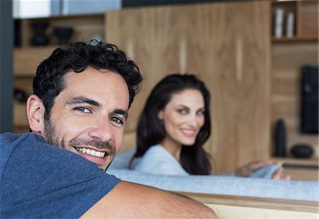 portrait of man side view - Portrait of smiling couple in living room Stock Photo - Premium Royalty-Free, Code: 6113-07565813