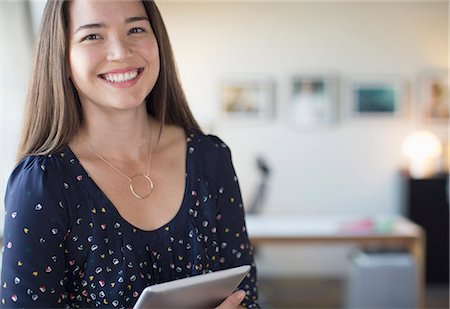 simsearch:6113-07565938,k - Portrait of smiling businesswoman with digital tablet in office Photographie de stock - Premium Libres de Droits, Code: 6113-07565950