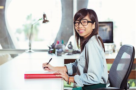 person sitting in chairs at desk side view - Portrait of confident businesswoman working at desk Stock Photo - Premium Royalty-Free, Code: 6113-07565989