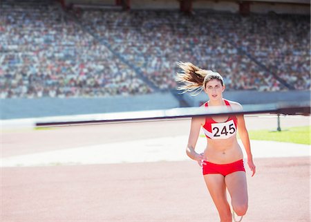 female athlete running - High jumper nearing pole Stock Photo - Premium Royalty-Free, Code: 6113-07588693