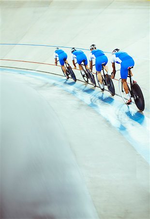 followers - Track cycling team riding in velodrome Stock Photo - Premium Royalty-Free, Code: 6113-07588692