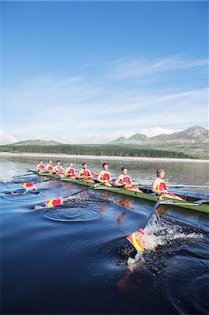 sport rowing teamwork - Rowing crew rowing scull on lake Stock Photo - Premium Royalty-Free, Code: 6113-07588698