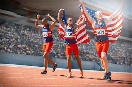 simsearch:632-05845738,k - American athletes celebrating on track Photographie de stock - Premium Libres de Droits, Code: 6113-07588636