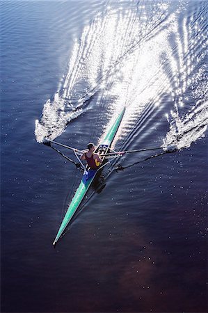 Man rowing scull on lake Stock Photo - Premium Royalty-Free, Code: 6113-07588746