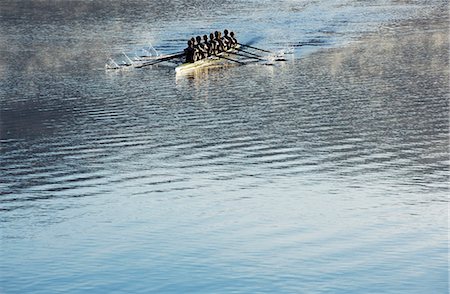 simsearch:6113-07588713,k - Rowing team rowing scull on lake Stock Photo - Premium Royalty-Free, Code: 6113-07588757