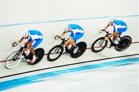 simsearch:6113-07588701,k - Track cycling team racing in velodrome Stock Photo - Premium Royalty-Free, Code: 6113-07588773