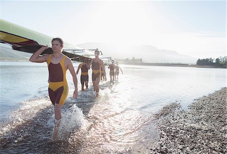 rowing boat - Rowing crew carrying scull out of lake Photographie de stock - Premium Libres de Droits, Code: 6113-07588770