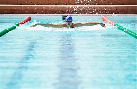 simsearch:614-08031116,k - Swimmer racing in pool Stock Photo - Premium Royalty-Free, Code: 6113-07588778