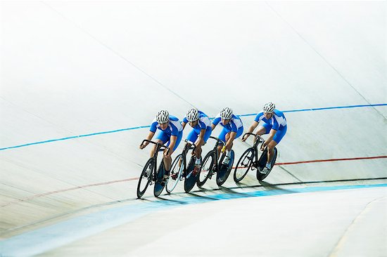 Track cyclists riding in velodrome Stock Photo - Premium Royalty-Free, Image code: 6113-07588779