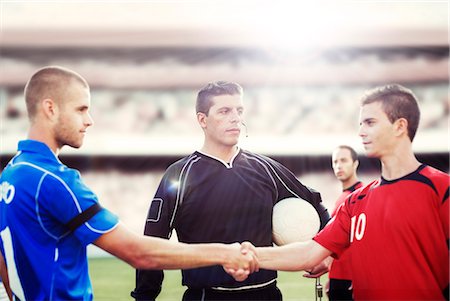 simsearch:6113-07588869,k - Soccer players shaking hands on field Photographie de stock - Premium Libres de Droits, Code: 6113-07588841