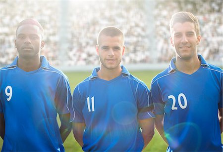 simsearch:6113-07588877,k - Soccer players smiling on field Foto de stock - Sin royalties Premium, Código: 6113-07588848