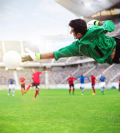 simsearch:6113-07588864,k - Goalie reaching for ball in mid-air on soccer field Stock Photo - Premium Royalty-Free, Code: 6113-07588849