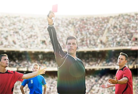 simsearch:6113-07588877,k - Referee flashing red card in soccer game Foto de stock - Sin royalties Premium, Código: 6113-07588888