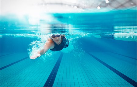 sports and swimming - Swimmer racing in pool Stock Photo - Premium Royalty-Free, Code: 6113-07588803