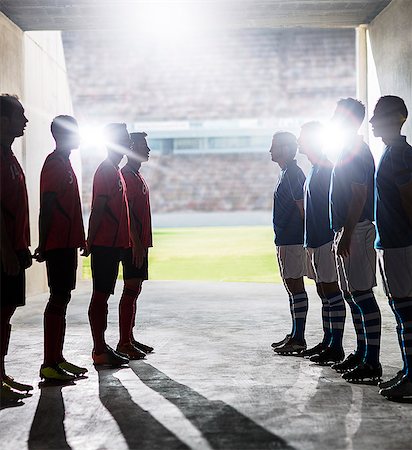 Silhouette of soccer teams greeting in locker room Stock Photo - Premium Royalty-Free, Code: 6113-07588832