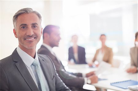 simsearch:6113-07588971,k - Portrait of confident businessman in conference room Foto de stock - Sin royalties Premium, Código: 6113-07588943