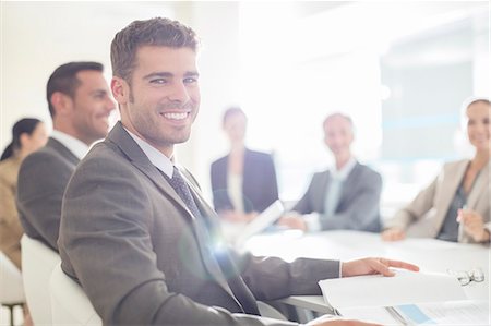 simsearch:6113-07542599,k - Portrait of confident businessman in conference room Stock Photo - Premium Royalty-Free, Code: 6113-07588947