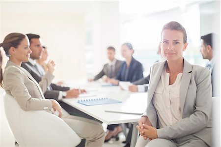 simsearch:6113-07542628,k - Portrait of confident businesswoman in conference room Foto de stock - Sin royalties Premium, Código: 6113-07588951