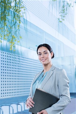 success and business - Portrait of confident businesswoman outdoors Stock Photo - Premium Royalty-Free, Code: 6113-07588980