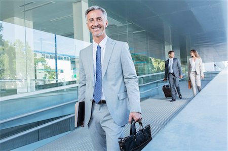 simsearch:6113-07588893,k - Portrait of businessman leaving office Stock Photo - Premium Royalty-Free, Code: 6113-07588984