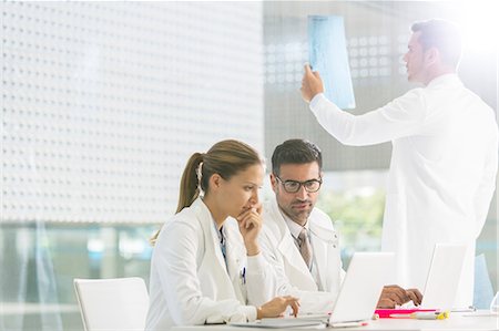 doctor observing a lady - Doctors working in hospital Stock Photo - Premium Royalty-Free, Code: 6113-07589054