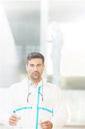 simsearch:6113-07589220,k - Portrait of confident scientist in clean suit in laboratory Stock Photo - Premium Royalty-Free, Code: 6113-07589037