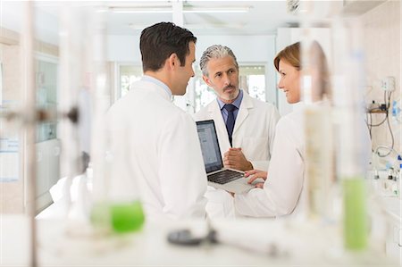 selective focus working not office - Scientists working at laptop in laboratory Stock Photo - Premium Royalty-Free, Code: 6113-07589140