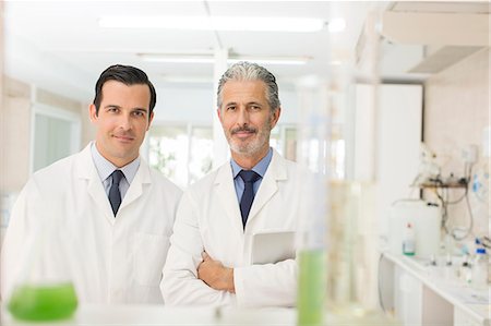 scientist looking at camera - Portrait of confident scientists in laboratory Stock Photo - Premium Royalty-Free, Code: 6113-07589171